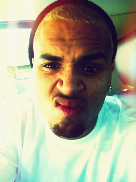 Chris Brown with his new blonde hairdo. Screw face.