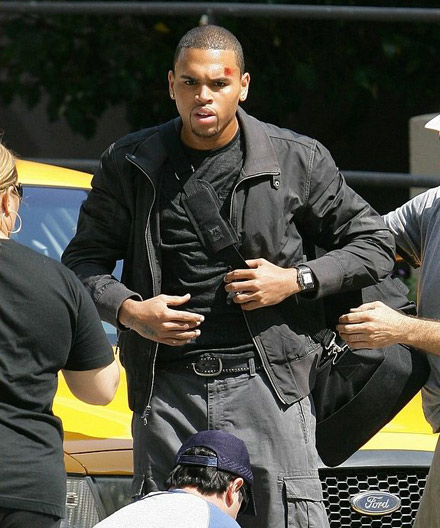 Chris Brown gets strapped up on Bone Deep set