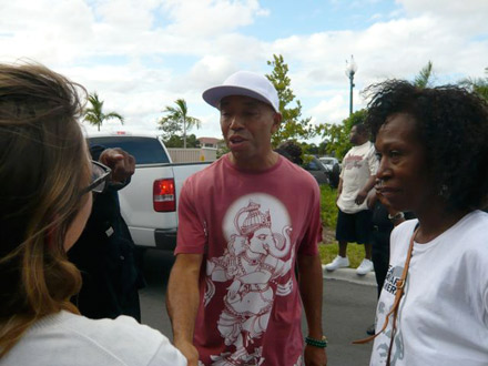 Russell Simmons greets voters on voting line in Florida