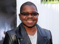 Gary Coleman sporting a black leather jacket and sunglasses