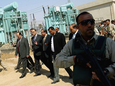 Iraqi Prime Minister Malaki with security forces