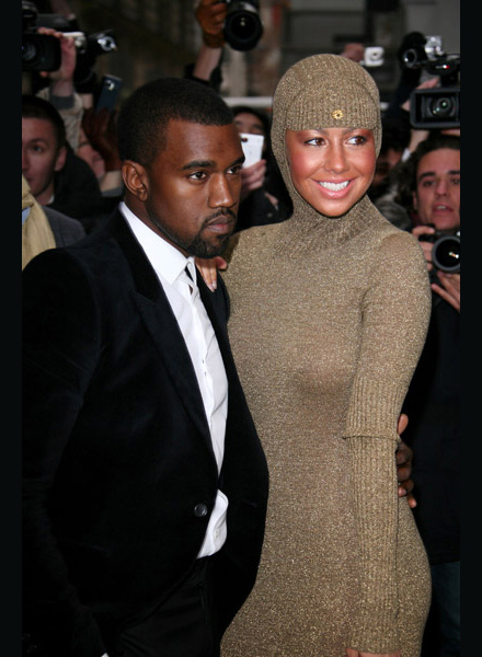 Kanye West and Amber Rose in golden hooded dress at Chanel Haute-Coutore fashion show in Paris