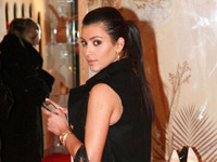 Kim Kardashian checks her Blackberry