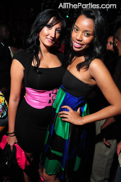 Pink belt, green and blue print dress, party goers at Mario Winans birthday party