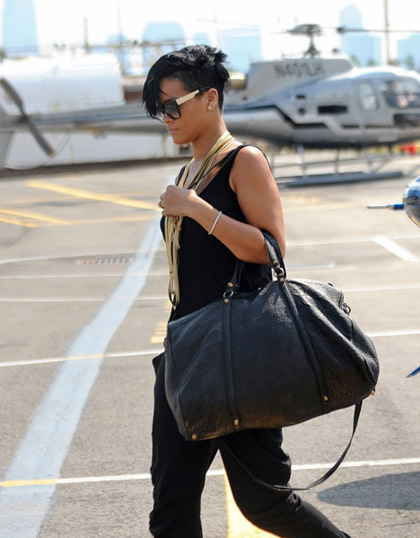 Rihanna gets off Liberty helicopter holding big black bag