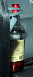 close up of a bottle of rum in Rihanna's limo/car