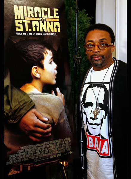 Spike Lee poses in front of Miracle at St. Anna poster