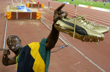 Usain Bolt strikes the Bolt pose