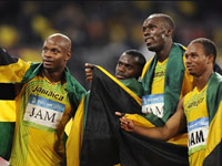 Usain Bolt with Jamaicain teammates win his third Olympic gold medal