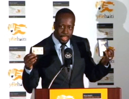 Wyclef in suit at Yele Haiti press conference