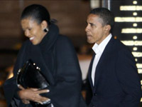 Barack and Michelle Obama walk into Spiaggia on date night