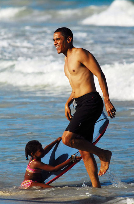 Barack Obama on beach with daughter in Hawaii