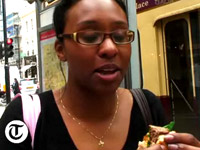 Woman taking a bite of Burger King's $185 Wagyu burger