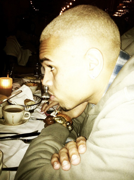 Chris Brown at a restaurant with his new blonde hairdo