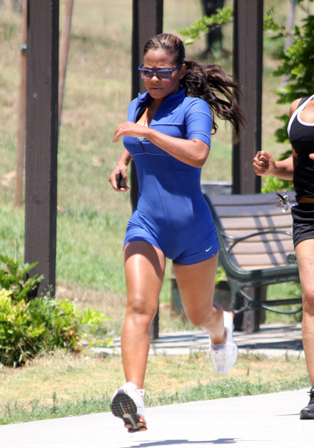 Christina Milian jogging in a park.