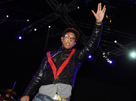 Pharrell flashes the Star Trak sign at the Diesel Rock and Roll circus