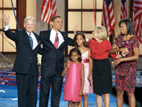 Barack Obama and Joe Biden, plus family. Mile High stadium