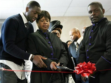 Dwayne Wade, Jolinda Wade and Ladell Jones ribbon cutting at Temple of Praise church