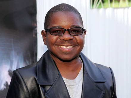 Gary Coleman sporting a black leather jacket and sunglasses