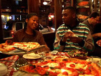 GZA and his son Karrem Justice eat pizza in New York restaurant