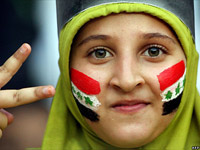 Iraqi kid flashes the peace sign