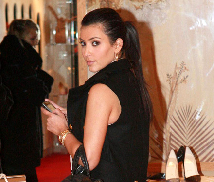 Kim Kardashian checks her Blackberry