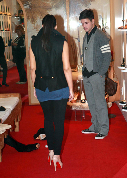 Kim Kardashian shows off shoes in a Beverly Hills store - from the back