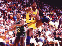 Magic Johnson throws a pass