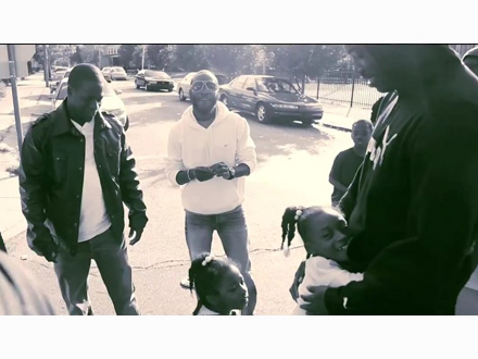 Meek Mill wearing a Puma sweatshirt greets some kids on the streets of Philly