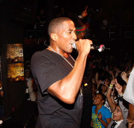 Q-Tip at the edge of The Knitting Factory stage, no hat, in a black t-shirt