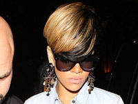 Rihanna at Mahiki bar in London wearing a flesh-toned skirt and light-grey jacket