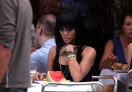 Rihanna about to dig into a watermelon