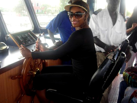 Captain Serena Williams steering a yacht