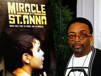 Spike Lee poses in front of Miracle at St. Anna poster