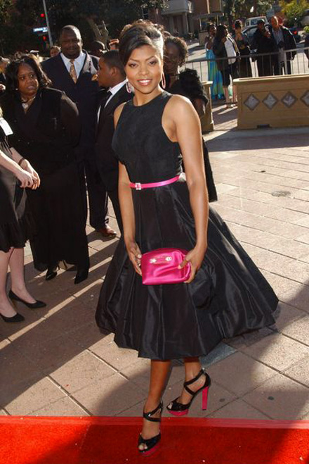 Taraji P. Henson in a black dress and pink purse