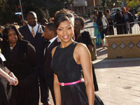 Taraji P. Henson in a black dress and pink purse