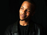 T.I. Cracks a half-smile