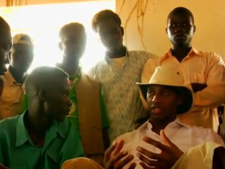 Tracy McGrady talking with Darfur refugees in 3 Points