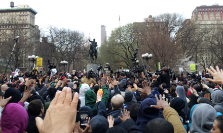 One hand up for the prayer for Trayvon martin's parents