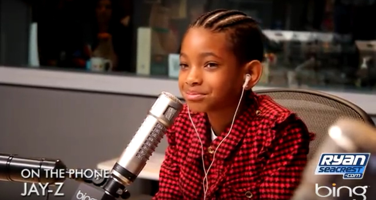 Willow Smith behind the studio mic, talking to Ryan Seacrest