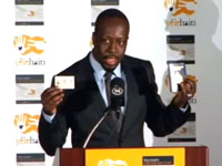 Wyclef in suit at Yele Haiti press conference